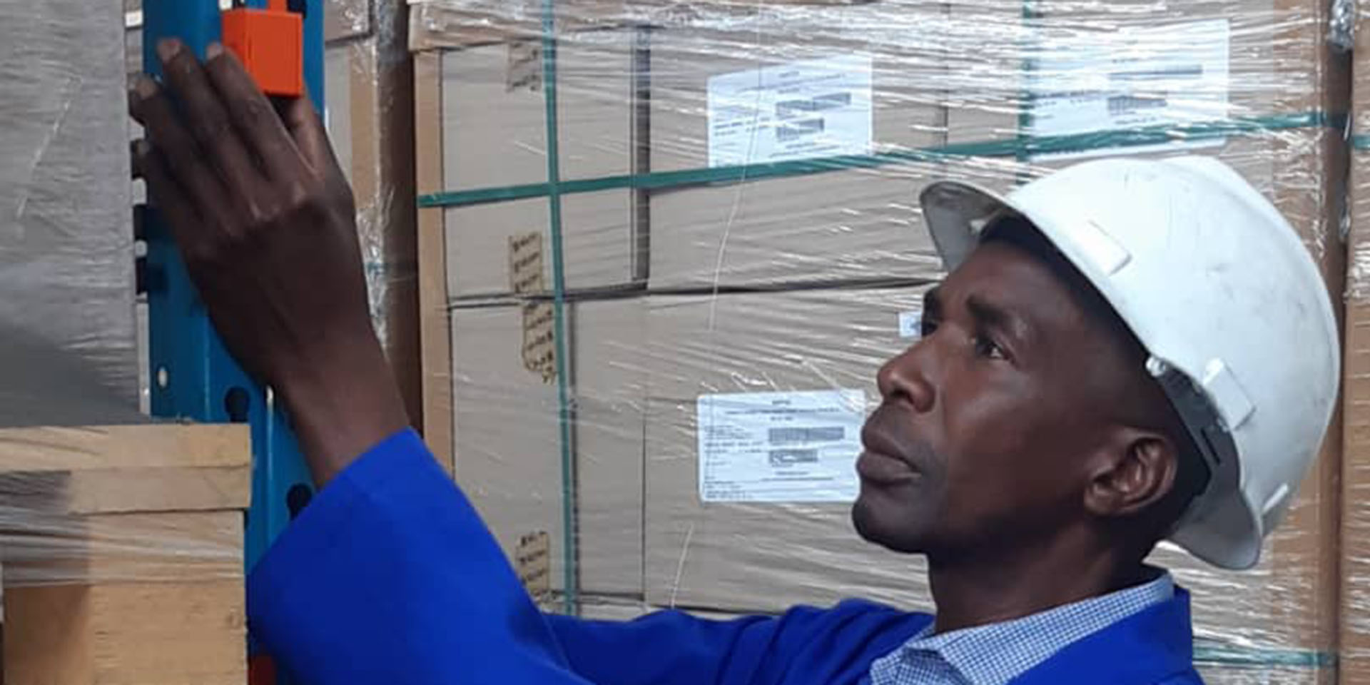 A warehouse temperature sensor being checked in Zimbabwe