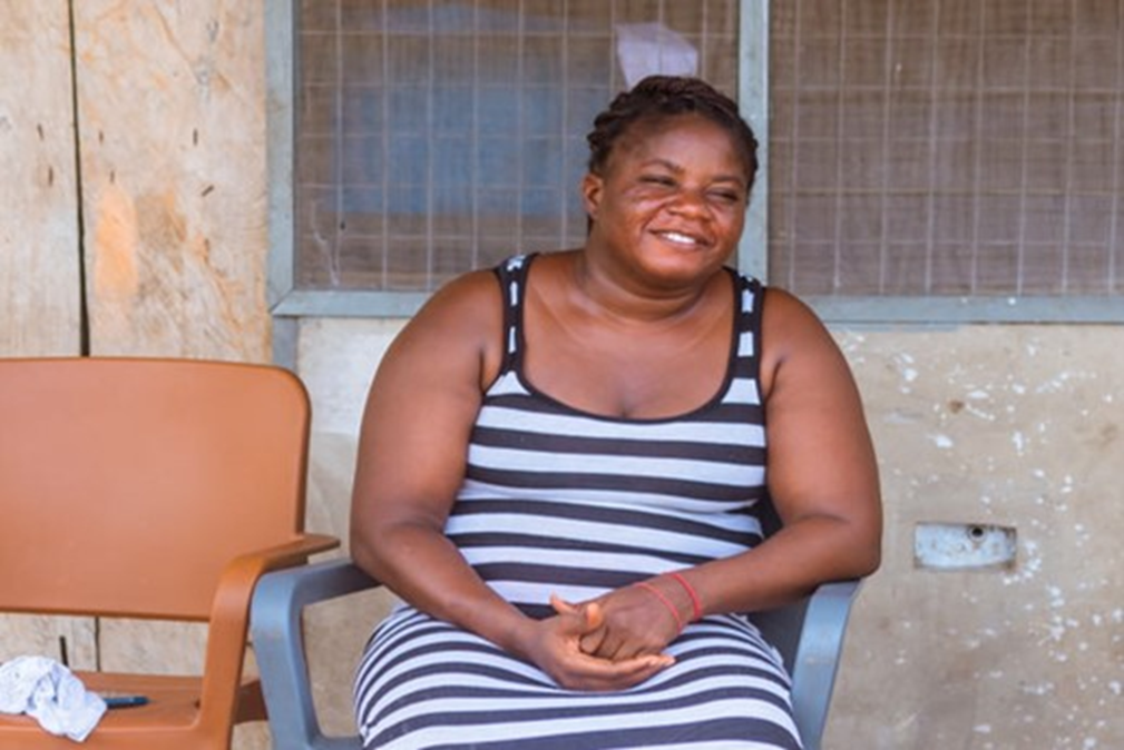 Evelyn beams with joy knowing that the nets will protect the children against malaria 